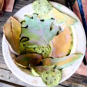 Picture of a finished clay bowl made using leaves as a pattern.