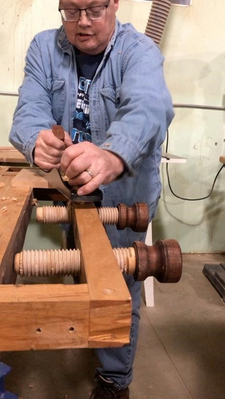 Rusty Farrington demonstrating a woodworking hand tool