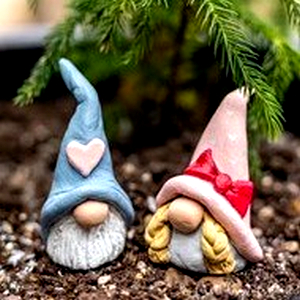 Picture of two Holiday Clay Gnomes.