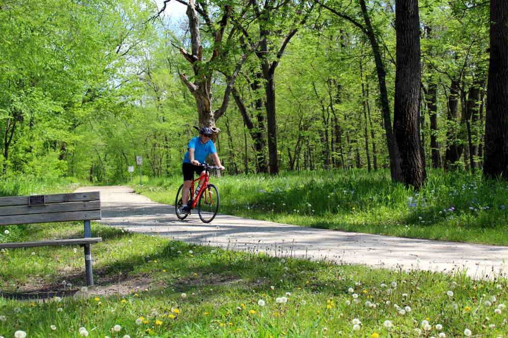 Man biking on trail at Briggs Woods Park